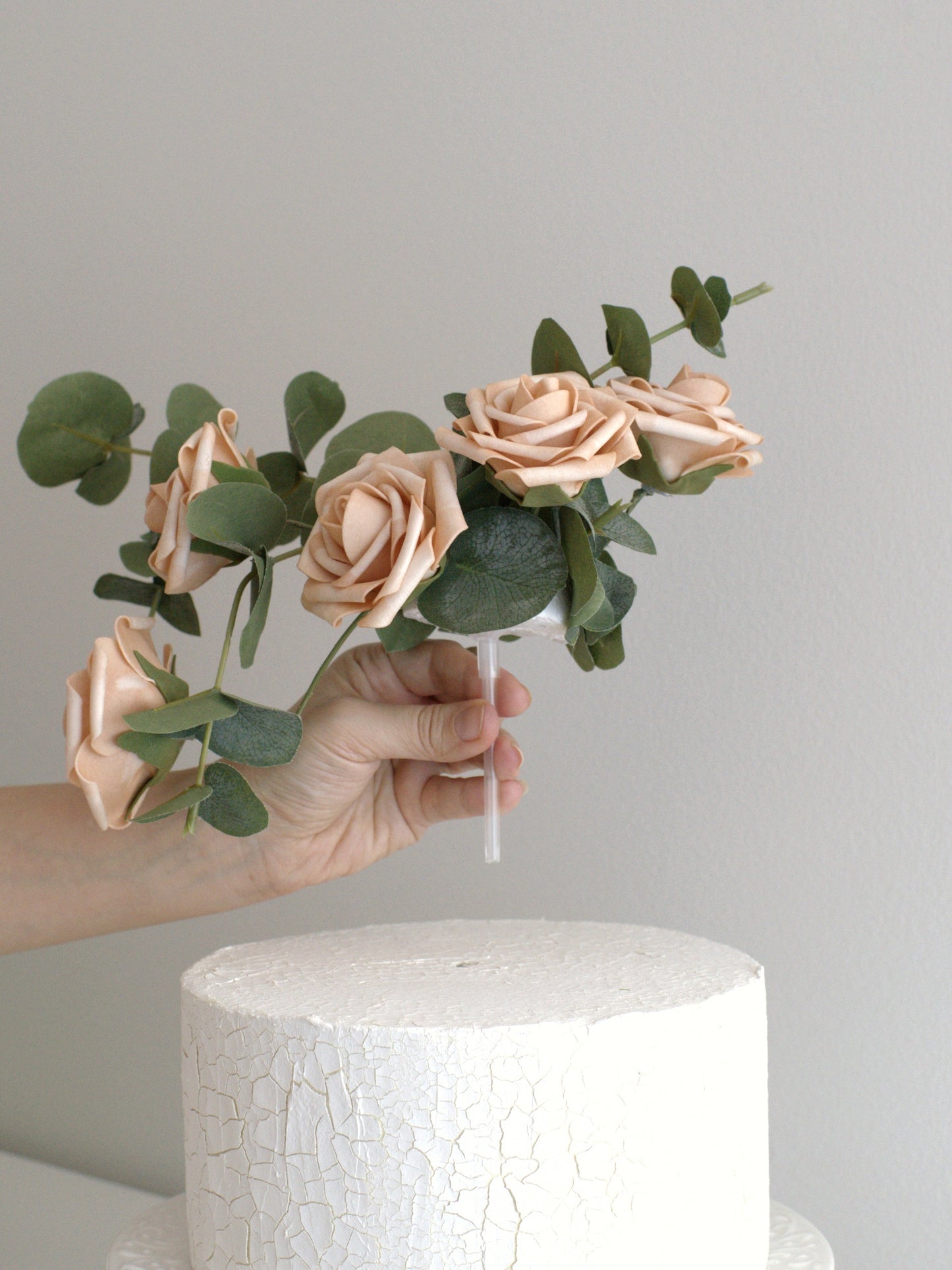 Easy-to-apply Four Beige Rose Cake Topper placed on a cake, highlighting how simple it is to add instant elegance with high-quality artificial flowers.
