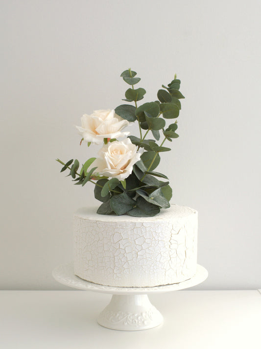 artificial real touch flower topper and white cake