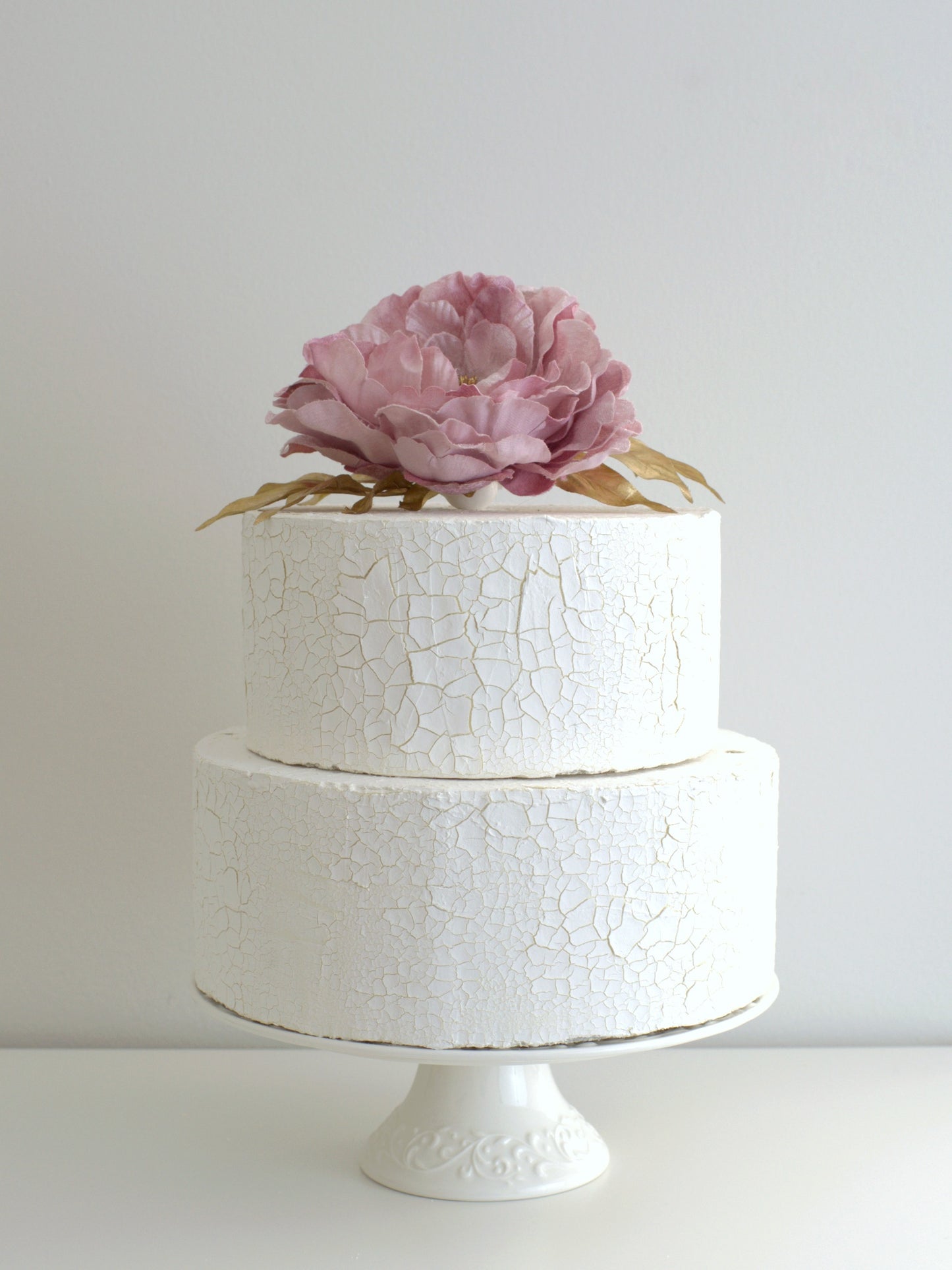 Peony Vintage Cake Topper with Gold Leaf, elegantly placed on a cake, featuring high-quality artificial flowers for weddings and special occasions.