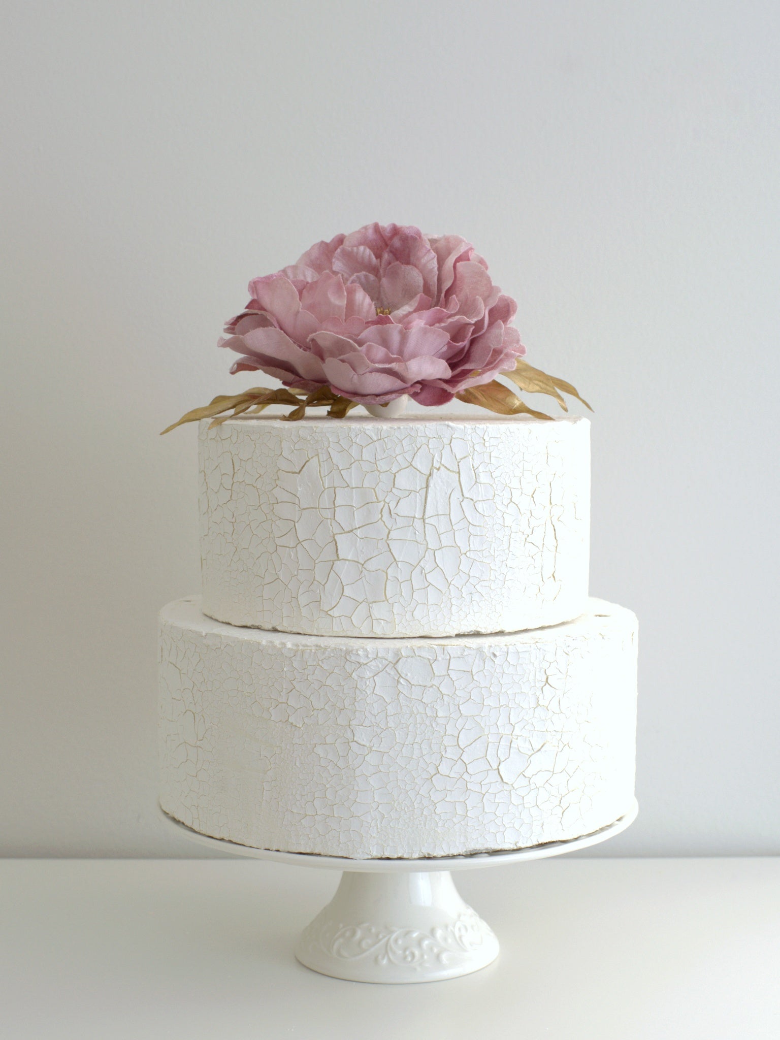 Peony Vintage Cake Topper with Gold Leaf, elegantly placed on a cake, featuring high-quality artificial flowers for weddings and special occasions.