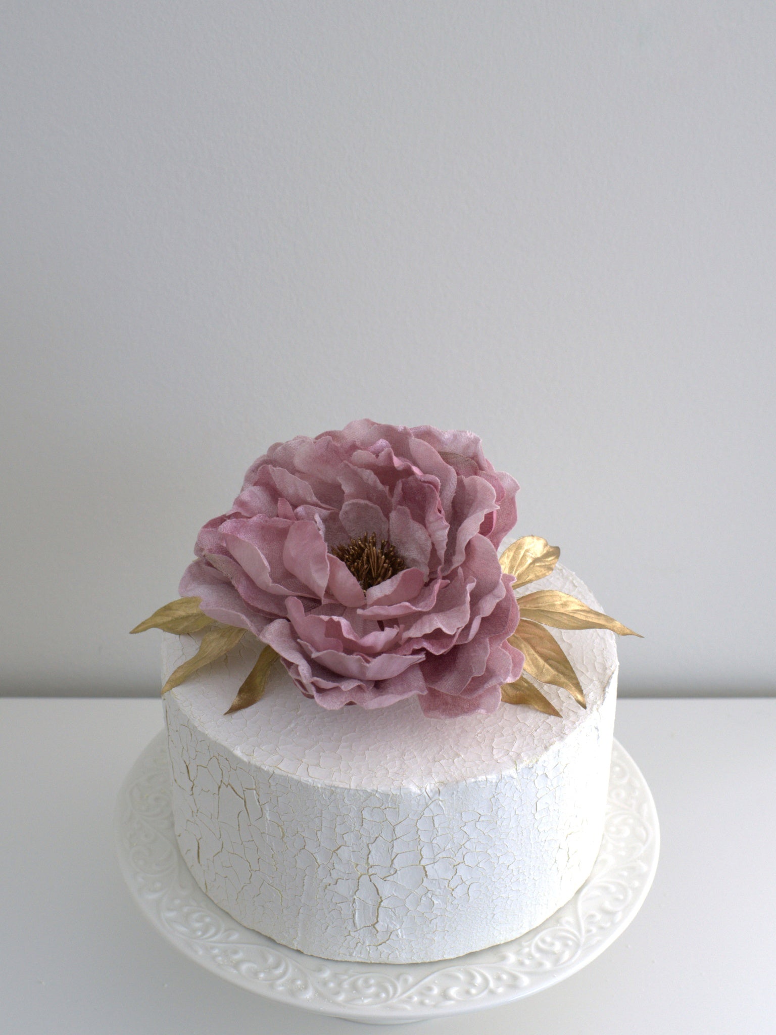 Peony Vintage Cake Topper with Gold Leaf, elegantly placed on a cake, featuring high-quality artificial flowers for weddings and special occasions.