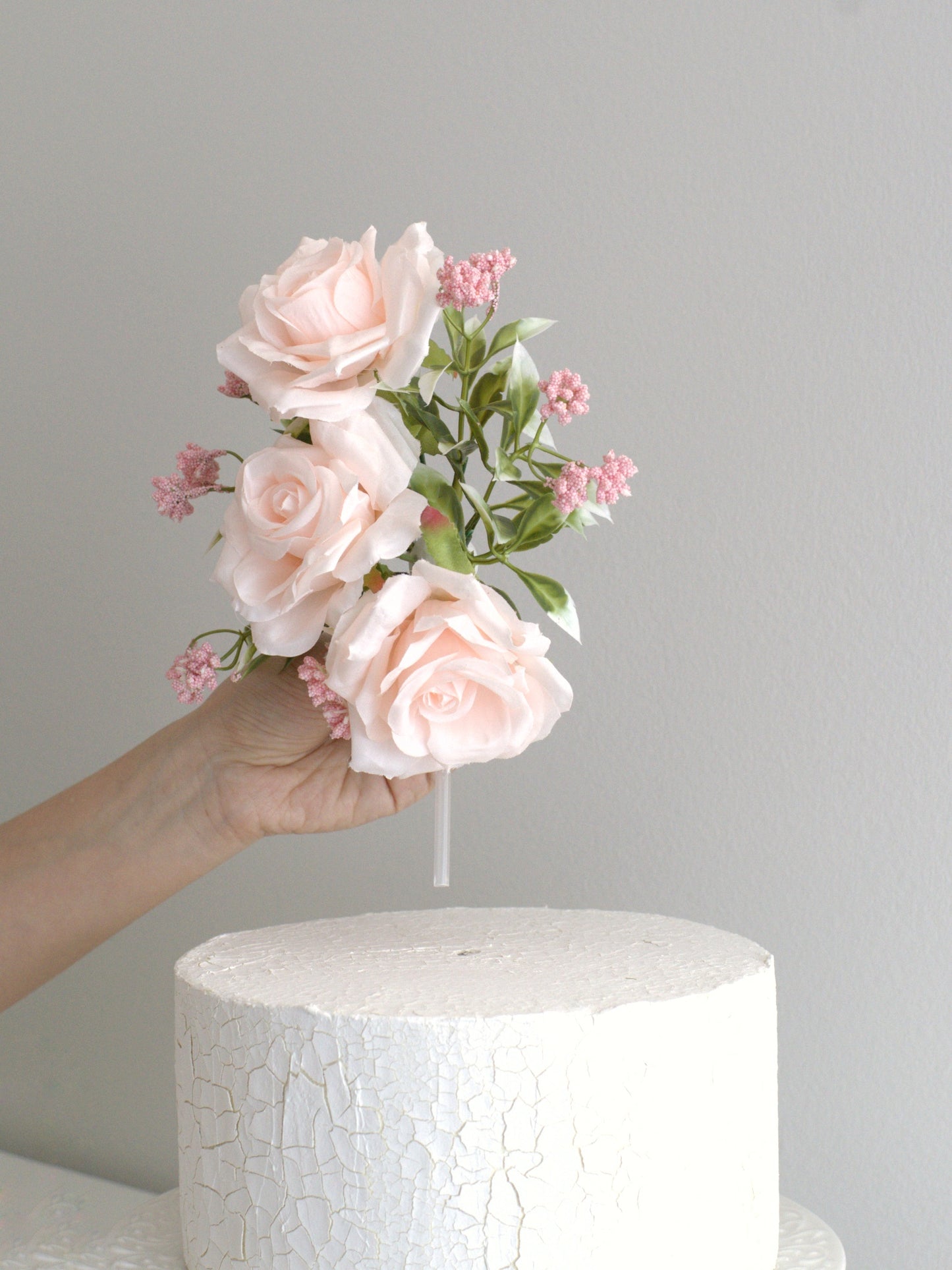 Effortless to apply, the Tree Blush Rose Cake Side Accent easily enhances any cake with high-quality artificial flowers, creating an elegant look in seconds.